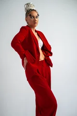 a beautiful girl in white sexy lingerie and a red jacket, posing in the studio. © Evgeny Leontiev