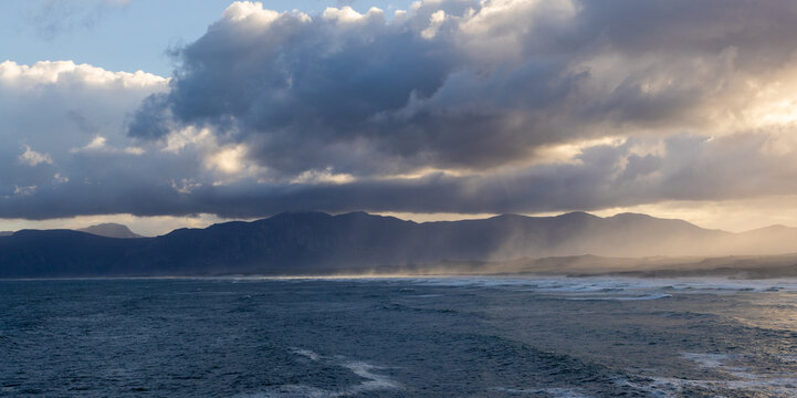 magnificent coastline and waves in early morning light, DeKelders, South Africa