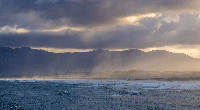 magnificent coastline and waves in early morning light, DeKelders, South Africa