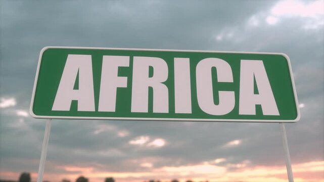 Green Africa Road Sign Against Dramatic Cloudy Sunset Sky