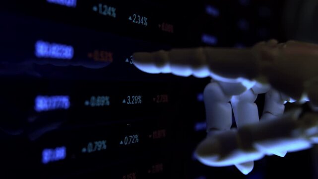 Cinematic close-up of a humanoid robot hand analyzing digital data from a computer monitor. Low depth of field, moody low-light dark office setting. Perfect for AI and future technology .