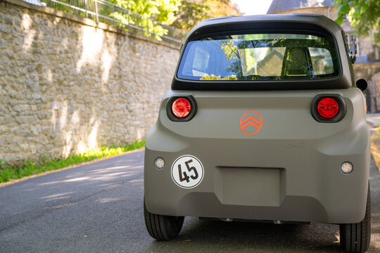 New 2026 Citroen Ami electric microcar parked in a small french town
