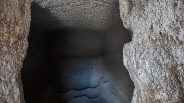 Revealing the interior of Vardzia cave monastery in Georgia, a stunning 12th-century structure carved into the Erusheti cliffs, showcasing intricate rock-cut architecture and soot traces