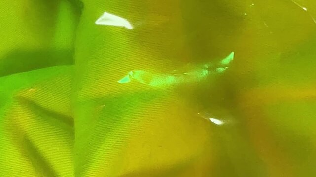 Abstract green metallic fabric texture