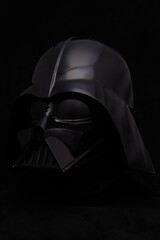 Obraz premium Professional photograph of a Darth Vader helmet on dark velvet, captured in El Salvador, Cinemark on June 26, 2026.