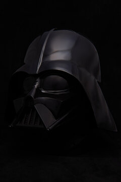 Professional photograph of a Darth Vader helmet on dark velvet, captured in El Salvador, Cinemark on June 26, 2026.
