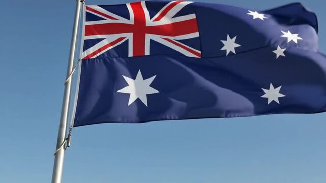 Australian flag waving against a clear blue sky