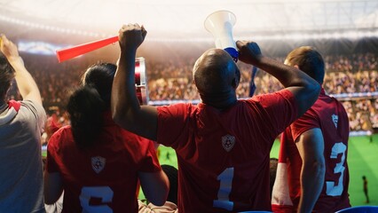 Obraz premium Close-up of cheerful soccer fans embracing in stadium stands, delighted by last minute goal for football fan and match day concepts.