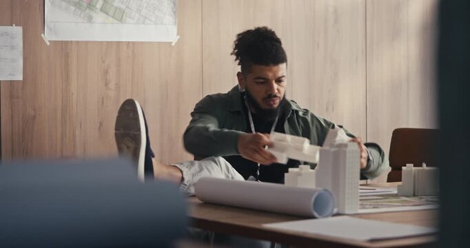 Focused man sorting items at a desk