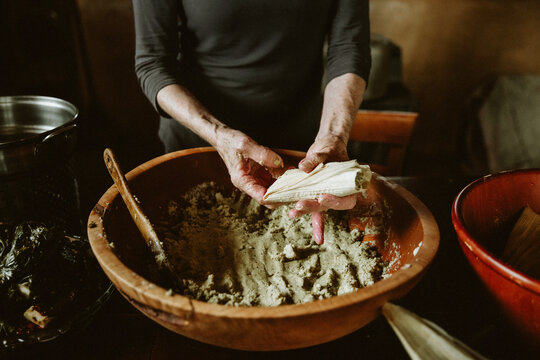 woman making tamales