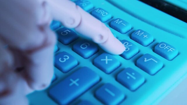 Macro of humanoid robot finger typing on office calculator. AI digital audit metaphor, numerical data entry, computing expenses. Close up,  shallow DOF.
