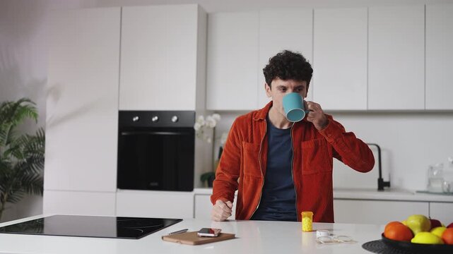 Happy man taking vitamins with water, supporting everyday health and wellness