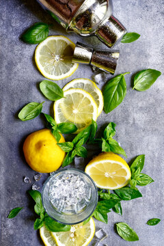 Ingredients fo making cold summer lemon and basil cocktail. Top view with copy space.