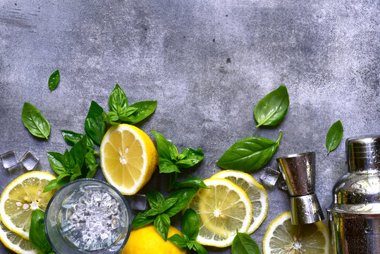 Ingredients fo making cold summer lemon and basil cocktail. Top view with copy space.
