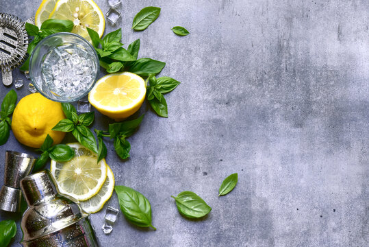 Ingredients fo making cold summer lemon and basil cocktail. Top view with copy space.