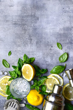 Ingredients fo making cold summer lemon and basil cocktail. Top view with copy space.