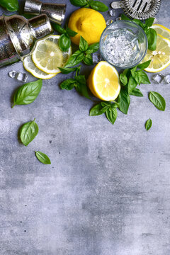 Ingredients fo making cold summer lemon and basil cocktail. Top view with copy space.