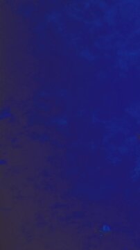 The background displays a mix of blue and brown colors with smooth and flowing patterns. It creates a rich texture that offers a sense of depth. This design can be used for various projects.