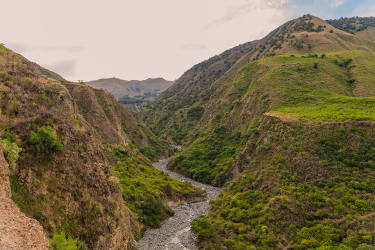 Scenic view of Pairumani valley canyon with a dry riverbed surrounded by green mountains in Cochabamba Bolivia