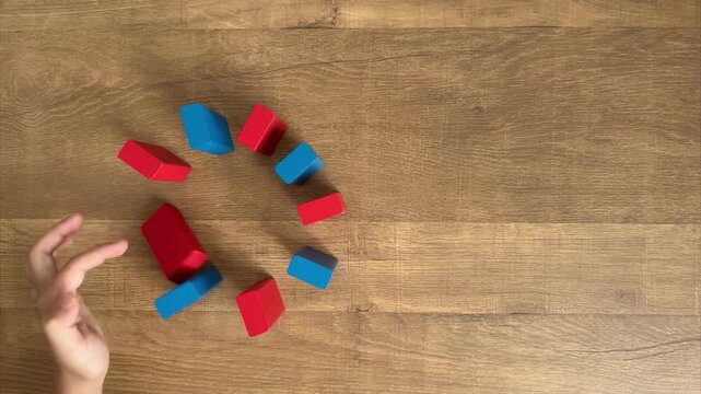 Child Hand Tries Circular Domino with Red and Blue Blocks but Fails and Knocks Them Down One by One, 4K
