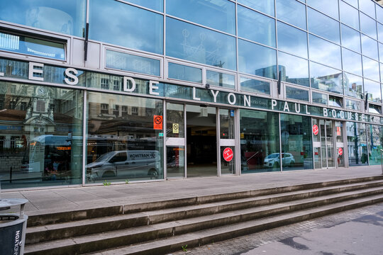Lyon, France - 10.03.2026. The main glass facade and entrance of the famous Halles de Lyon Paul Bocuse, a premier indoor food market in Lyon, France. The sleek, contemporary glass structure features w