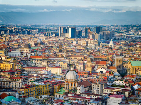 Aerial drone view of Naples old town panorama, scenic cityscape of historic center and iconic volcano view in Italy