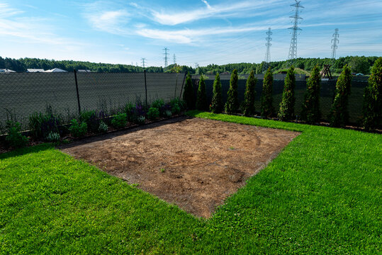 Backyard garden showing damaged lawn after expansion pool