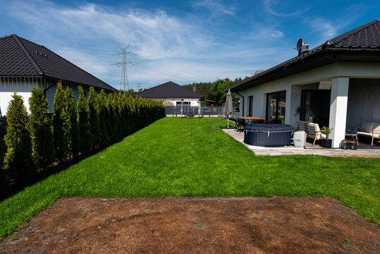 Lawn damaged from inflatable pool showing brown grass
