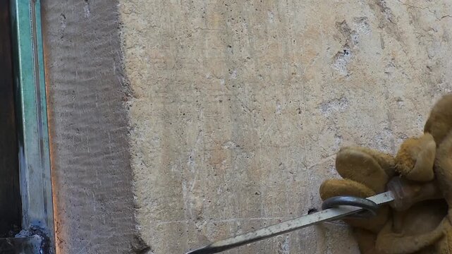 Installing a metal eye bolt screw into a concrete wall