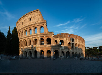 Naklejka premium The Colosseum at sunset in Rome, Italy 