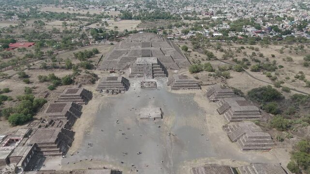 Aerial perspective capturing the vastness of the ancient avenue of the dead, flanked by impressive pre aztec pyramids and temples at the teotihuacan archaeological site near mexico city