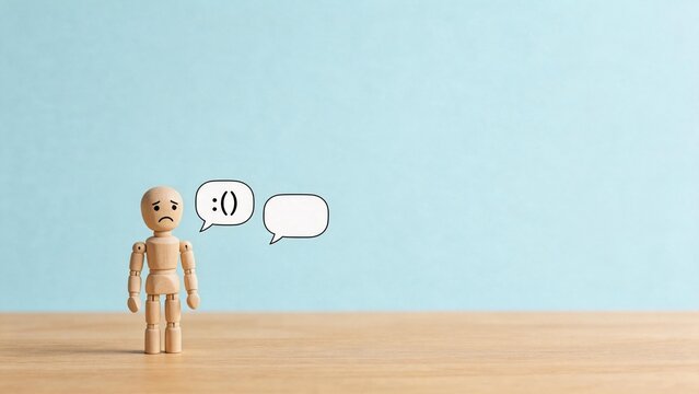 Wooden figure with sad expression