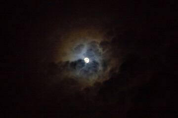  Full moon in the dark night sky with clouds, © ric