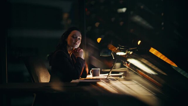 Pensive manager finish work night office closeup. Businesswoman looking distance