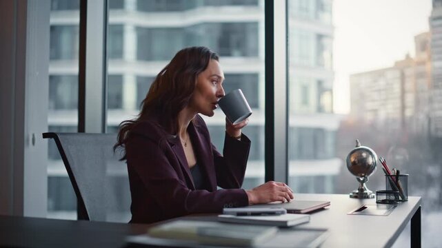 Relaxed boss taking break having coffee sip thinking panoramic cabinet closeup