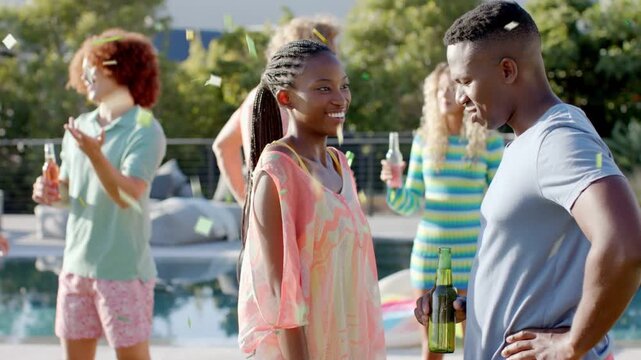 Confetti falling sparking woman showing interest while man listening at pool, marketing drinks
