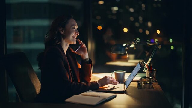 Corporate specialist talking smartphone browsing laptop at late night closeup