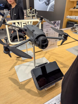 Dji mavic 4 pro drone displayed in electronics store