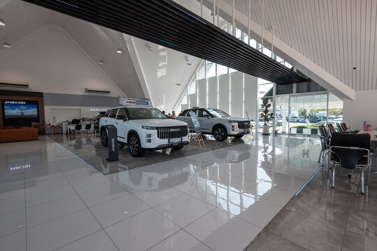 Jaecoo j7 suv cars in modern showroom interior