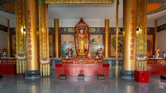 Guanyin statue standing on altar in buddhist temple