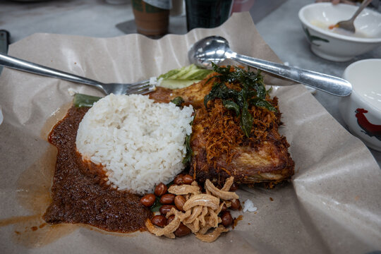 Nasi lemak with fried chicken and sambal