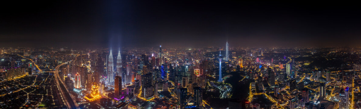 Kuala lumpur cityscape with illuminated petronas towers at night