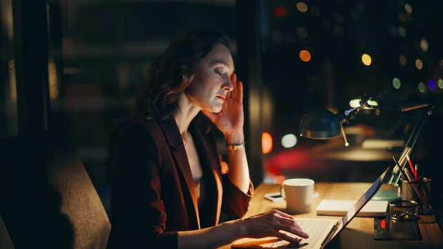 Overworked entrepreneur having migraine looking laptop night workplace closeup