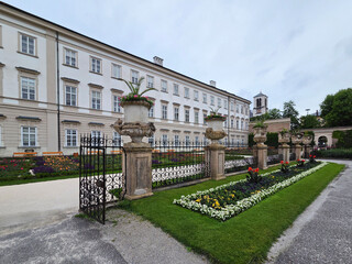 Fototapeta premium Mirabell Palace and Gardens in Salzburg, Austria on rainy overcast summer afternoon.