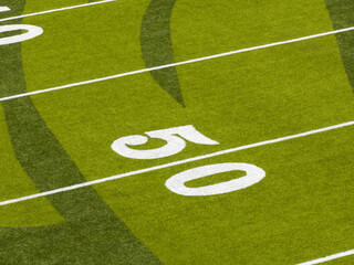 Obraz premium Close-up of green football field grass