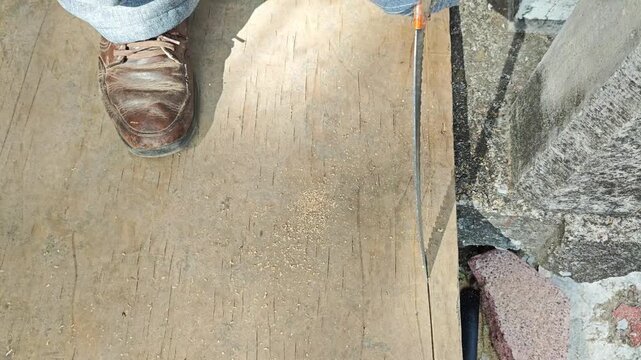 Manual process cutting and trimming the edge of an mdf wood board