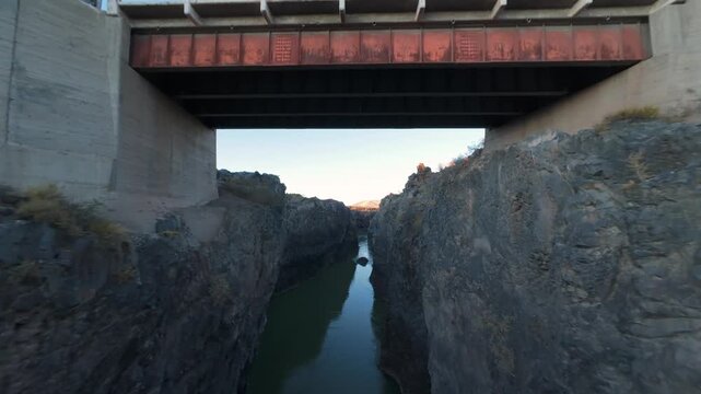 Aerial Drone FPV Fly Under Bridge at Argentina Mendoza River Canyon La Payunia Reserve