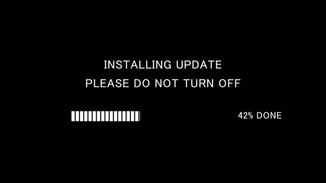 Video of loading progress bar with on-screen text installing update please do not turn off on black background