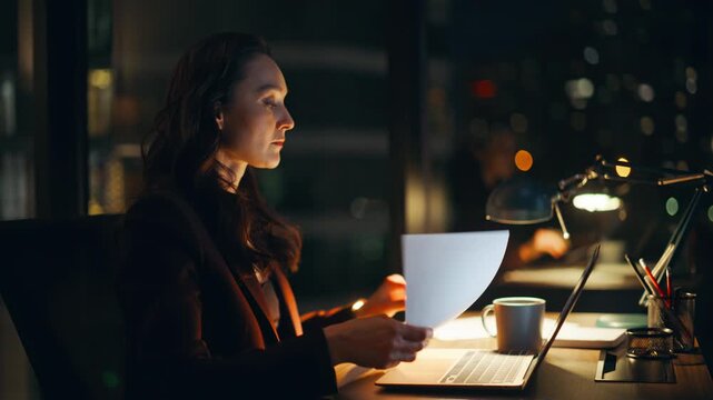 Focused lady browsing internet laptop dark home closeup. Woman typing keyboard