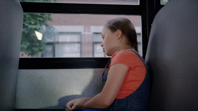 Sad girl struggling after school crying on the bus